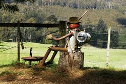 Old Swaggie kicking back by the campfire - this one is prepared for a cold night, he's even got a keg on his back! - Tasmania