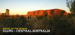 The soft morning sun softly touches the heart of Australia - Uluru