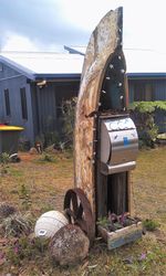 A great use for an old boat that no longer floats - retired to a life of a letterbox - photo by Vivienne Tracy