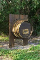 Reusing an preloved wine barrel for a letterbox - makes you want to whet your whistle - photo by Vivienne Tracy